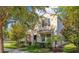 Charming two-story home with a well-maintained lawn and lush landscaping, creating curb appeal at 8256 Bayview Crossing Dr, Winter Garden, FL 34787