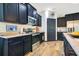 Well-equipped kitchen with dark wood cabinets and stainless steel appliances, perfect for culinary adventures at 8256 Bayview Crossing Dr, Winter Garden, FL 34787