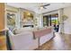 Bright living room with fireplace, large windows, ceiling fan and access to patio at 8256 Bayview Crossing Dr, Winter Garden, FL 34787