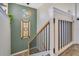 Stylish staircase with a wood railing, black iron balusters, and a safety gate at 8256 Bayview Crossing Dr, Winter Garden, FL 34787
