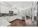 Spacious kitchen with stainless steel appliances, granite countertops and eat-in dining area at 8612 Summerville Pl, Orlando, FL 32819
