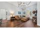 Cozy living room with coffered ceilings, wood floors, and comfortable furniture for relaxing at 8612 Summerville Pl, Orlando, FL 32819