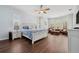 Spacious main bedroom featuring wood floors, lots of light, and a sitting area at 8612 Summerville Pl, Orlando, FL 32819
