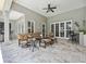 Spacious patio features lounge seating, a bar, and a ceiling fan at 8612 Summerville Pl, Orlando, FL 32819