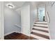 Stairway features white trim, painted walls, and wood steps at 8612 Summerville Pl, Orlando, FL 32819