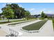 Outdoor bocce ball courts with well-maintained landscaping and benches for relaxing and socializing at 6231 Atkinson Ln, The Villages, FL 32163