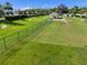 Fenced dog park featuring a covered shelter and plenty of space for dogs to play at 6231 Atkinson Ln, The Villages, FL 32163
