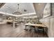 Spacious event space featuring tables, chairs, chandeliers, and elegant décor at 6231 Atkinson Ln, The Villages, FL 32163