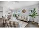 Bright living room with stylish seating, dining area, and lovely backyard views at 6231 Atkinson Ln, The Villages, FL 32163