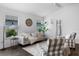Bright living room featuring stylish chairs, a comfortable sofa, and dark laminate floors at 6231 Atkinson Ln, The Villages, FL 32163