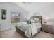 Cozy main bedroom featuring a queen bed, bedside tables, and a serene ambiance at 6231 Atkinson Ln, The Villages, FL 32163