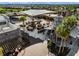 Outdoor seating area with shaded tables and landscaping at 6231 Atkinson Ln, The Villages, FL 32163