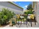 Cozy patio area with seating, bright pillows, and outdoor decor at 6231 Atkinson Ln, The Villages, FL 32163