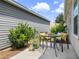 Cozy patio area with seating, bright pillows, and potted plants at 6231 Atkinson Ln, The Villages, FL 32163
