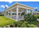 Inviting community pavilion with picnic tables, lush landscaping, and a serene atmosphere at 6231 Atkinson Ln, The Villages, FL 32163