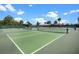 Multiple tennis courts showcasing the community's recreational amenities under a blue sky at 6231 Atkinson Ln, The Villages, FL 32163