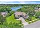 Stunning aerial view of a lakeside property with lush landscaping and ample space at 1017 Parkside Pointe Blvd, Apopka, FL 32712