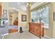 Dining room featuring an antique wooden buffet, large window, and views to other rooms at 1017 Parkside Pointe Blvd, Apopka, FL 32712