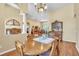 Traditional dining room features hardwood floors, wooden table and hutch, and decorative accents at 1017 Parkside Pointe Blvd, Apopka, FL 32712