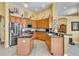 Updated kitchen featuring an island, ample cabinet space, and stainless steel appliances at 1017 Parkside Pointe Blvd, Apopka, FL 32712