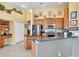 Spacious kitchen with stainless steel appliances, granite counters, and decor at 1017 Parkside Pointe Blvd, Apopka, FL 32712