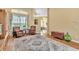 Bright living room with ample natural light, hardwood floors, area rug, and comfortable seating at 1017 Parkside Pointe Blvd, Apopka, FL 32712