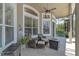 Outdoor patio with lounge seating, ceiling fan, and a view of screened-in pool at 1017 Parkside Pointe Blvd, Apopka, FL 32712