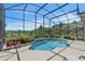 Inviting screened-in pool with well maintained landscaping and a view of the beautiful scenic surroundings at 1017 Parkside Pointe Blvd, Apopka, FL 32712