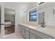 Light and bright bathroom with granite countertops, tile floor, and an ensuite bathroom at 103 Odin Dr, Winter Haven, FL 33884