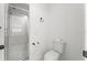 Bathroom with walk-in shower and toilet at 103 Odin Dr, Winter Haven, FL 33884