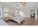 Bedroom with hardwood floors, ceiling fan, and view into another room at 103 Odin Dr, Winter Haven, FL 33884