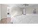 Neutral bedroom featuring two beds, a ceiling fan, and an ensuite bathroom at 103 Odin Dr, Winter Haven, FL 33884