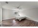 Neutral bedroom with wood-look floors and a ceiling fan at 103 Odin Dr, Winter Haven, FL 33884