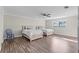 Bedroom with two beds, ceiling fan, and vinyl wood flooring at 103 Odin Dr, Winter Haven, FL 33884