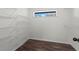Walk-in closet with shelving and laminate wood flooring with a view to the outside at 103 Odin Dr, Winter Haven, FL 33884