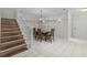 Dining room area with hardwood staircase and a hanging chandelier at 103 Odin Dr, Winter Haven, FL 33884