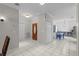 Inviting entryway with tile flooring, neutral walls, and an updated front door at 103 Odin Dr, Winter Haven, FL 33884