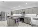 Bright, neutral kitchen featuring stainless steel appliances and a center island at 103 Odin Dr, Winter Haven, FL 33884