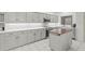 Bright, modern kitchen featuring white countertops, and under cabinet lighting at 103 Odin Dr, Winter Haven, FL 33884