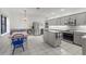 Bright, neutral kitchen featuring stainless steel appliances and a center island at 103 Odin Dr, Winter Haven, FL 33884