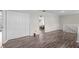 Upstairs living area with hardwood floors, closet, and staircase railing at 103 Odin Dr, Winter Haven, FL 33884