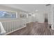 Upstairs living room with hardwood floors and plenty of natural light at 103 Odin Dr, Winter Haven, FL 33884
