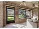 Relax in this screened-in patio with tile flooring and a ceiling fan at 103 Odin Dr, Winter Haven, FL 33884