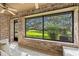 Picturesque patio showcasing a large window with scenic views of the lush green landscape at 103 Odin Dr, Winter Haven, FL 33884