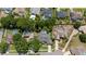 Aerial view showcasing a neighborhood with mature trees and private backyard pools at 1107 Almond Tree Cir, Orlando, FL 32835
