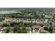 High aerial photograph of the lush community, displaying the homes, mature trees, and surrounding area with a still lake at 1107 Almond Tree Cir, Orlando, FL 32835