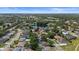 Lovely aerial showing neighborhood and nearby lake with mature trees and well maintained lawns at 1107 Almond Tree Cir, Orlando, FL 32835