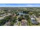 Gorgeous aerial shot showcasing the serene neighborhood, a tranquil lake, and the home's prime location near water at 1107 Almond Tree Cir, Orlando, FL 32835