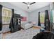 Bedroom featuring light-blue walls, hardwood floors, ceiling fan, and decor at 1107 Almond Tree Cir, Orlando, FL 32835