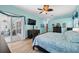 Bedroom with bright blue walls, wood floors, and sliding glass doors to the porch at 1107 Almond Tree Cir, Orlando, FL 32835